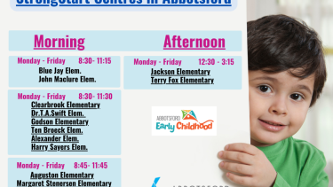 Child holding card with StrongStart schedules