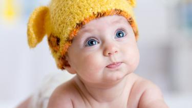 baby with hat that has ears on it