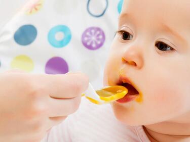feeding child with a spoon
